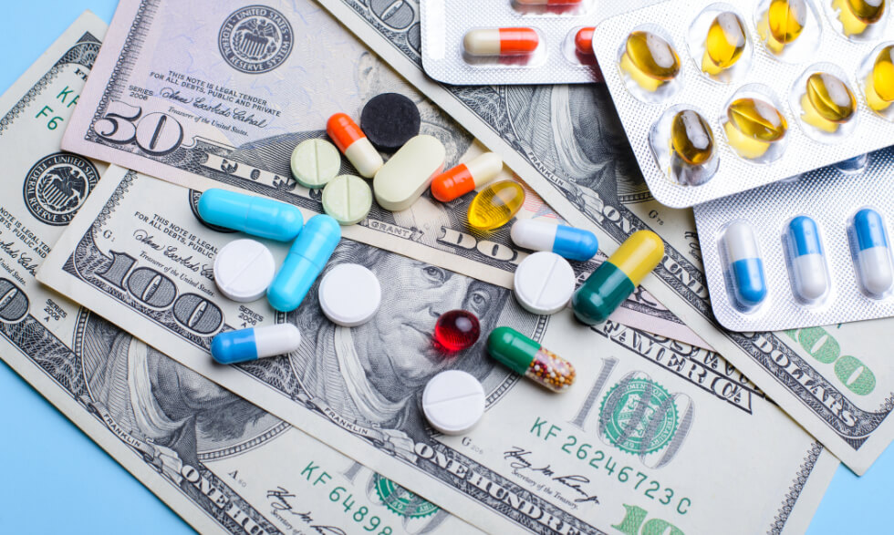 prescription capsules spread over currency